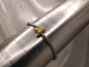 The watch bracelet wrapped around a metal ring sizer, showing a circumference measurement of approximately 160mm.