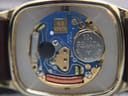 Close-up of the Zenith Swiss quartz movement (Zenith 7 jewels) and Renata battery visible inside the open case.