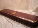 Closed brown display box with gold trim and F.H. Buck Jewellers logo.