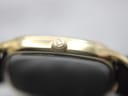 Close-up of the original gold-tone Zenith signed crown.