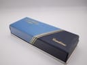 Exterior view of the closed vintage blue and gold Rotary presentation box, featuring gold striped detailing.