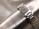 The Gucci bracelet wrapped around a watch sizing cone, indicating a wrist circumference measurement of 155mm.