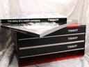 Original Tissot booklets, including 'The story of a watch company' and 'Tissot General Catalogue', on top of the box.
