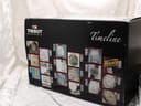 Side view of the Tissot watch box sleeve, showing a 'Timeline' graphic with vintage watch images.