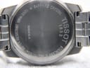 Close-up of the Tissot PR 100 case back, showing engraved details and brushed finish.