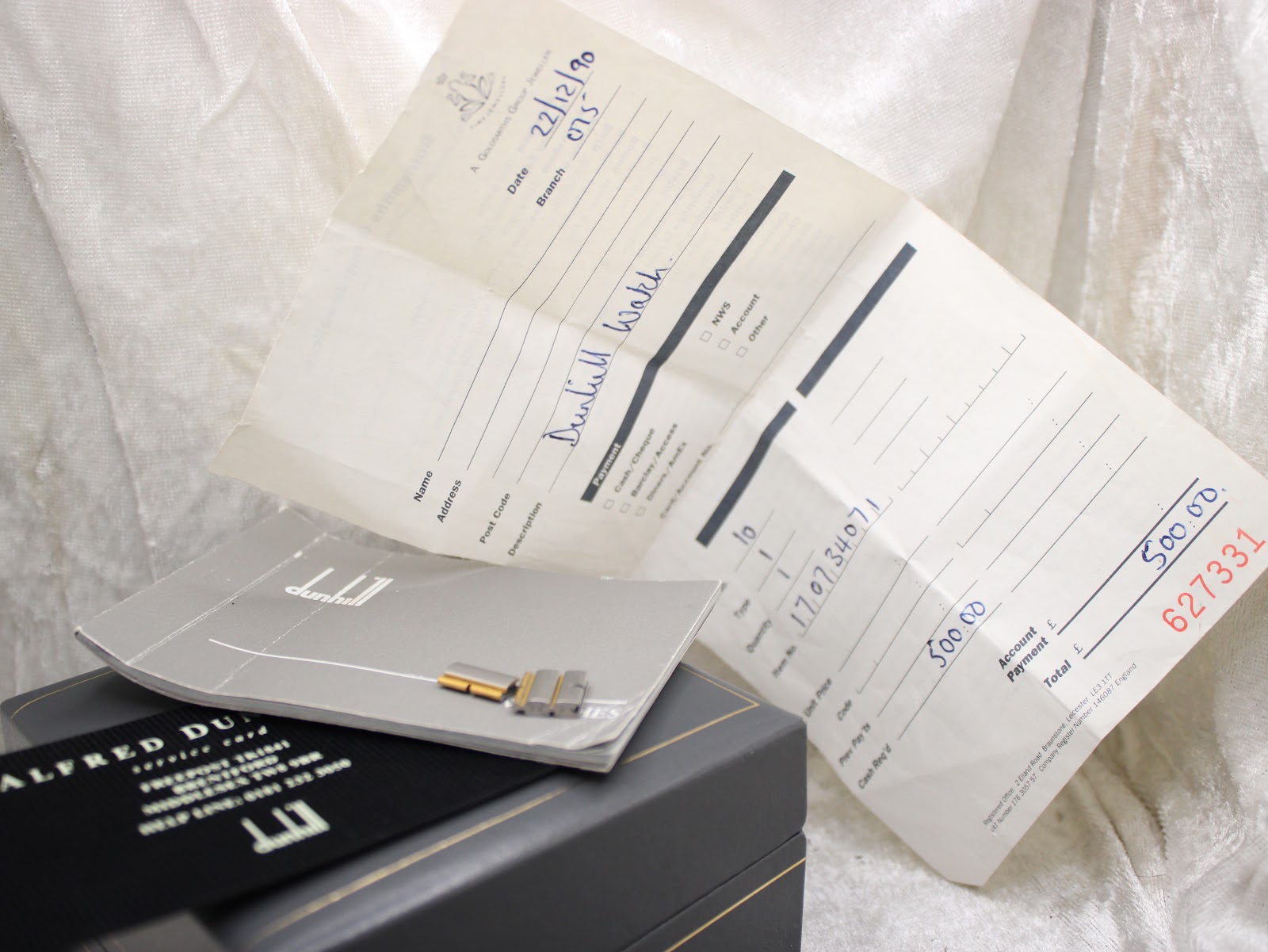 Original Dunhill sales receipt dated December 1990, a Dunhill booklet, and extra bracelet links alongside the watch box.