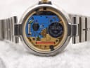 Open case back view revealing the blue Swiss quartz movement with a new Renata 371 battery.