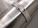 Close-up of the two-tone bracelet clasped around a wrist sizing gauge, indicating a wrist size of 160mm (16cm).