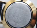Close-up of the brushed stainless steel case back, showing serial numbers '87-45-882 / 176509' and 'WATER RESISTANT' engraving.