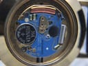 Macro shot of the blue Swiss Movado quartz movement with 7 jewels and Renata 364 battery visible.