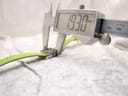 Digital caliper measuring the width of the Gucci 7900P watch case, displaying a precise measurement of "19.30 mm".