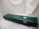 Closed, original dark green Gucci presentation box with golden logo, featuring a small white label with "836".