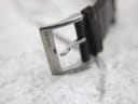 Close-up of the stainless steel buckle, clearly showing the "GUCCI" engraving.
