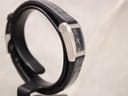 Another angled side view of the Gucci 8600L watch on a display stand, highlighting its slim profile and design.