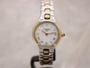 Tissot G327 ladies two-tone watch showing white dial with gold baton hour markers and sapphire crystal