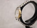 Side profile of Tissot G327 22mm round case showing slim dress watch silhouette and gold-plated finish