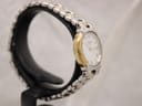 Two-tone stainless steel and gold-tone bracelet clasp detail of Tissot G327 ladies watch