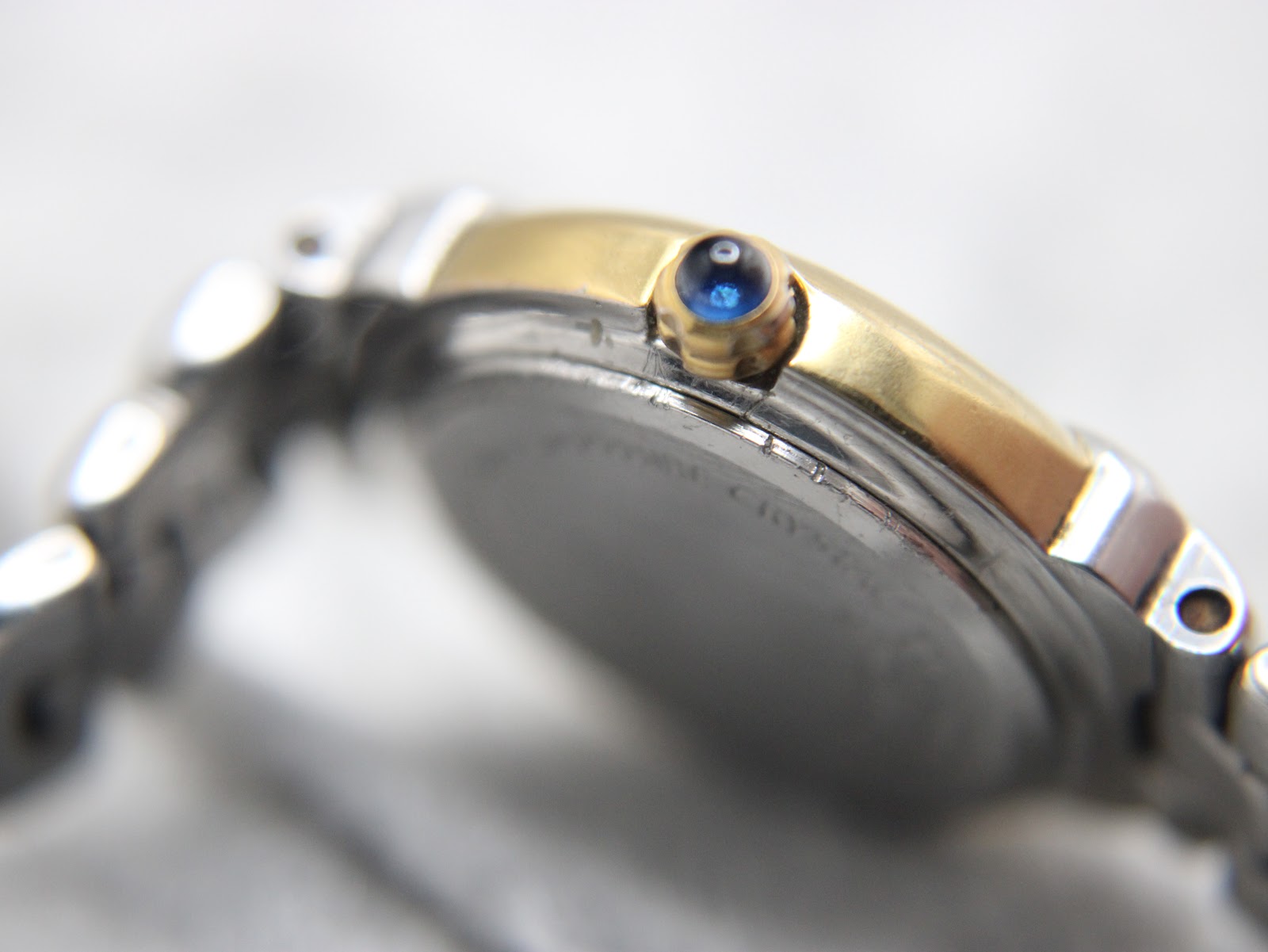 Two-tone bracelet strap detail of Tissot G327 showing gold and steel link construction