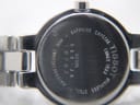 Close-up of the case back showing 'Tissot since 1853', 'Sapphire Crystal', 'Stainless Steel', '30M Water Resistant' and model 'SKQ-JA G330K'.