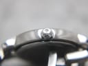 Macro shot of the Tissot signed crown with the 'T' logo.