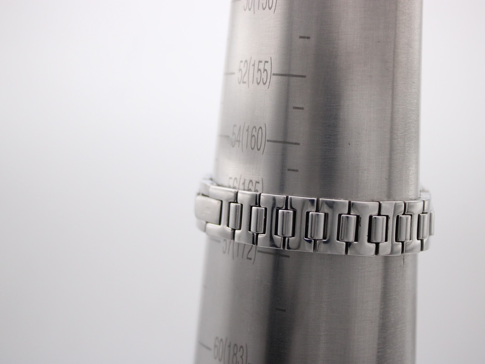 Tissot watch bracelet wrapped around a wrist sizing gauge, indicating a maximum wrist fit of 172mm.