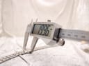 Digital caliper measuring the watch case diameter at precisely 19.96mm.