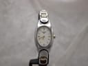 Front view of Tissot G350 ladies' watch with white mother of pearl oval dial and two-tone bracelet.