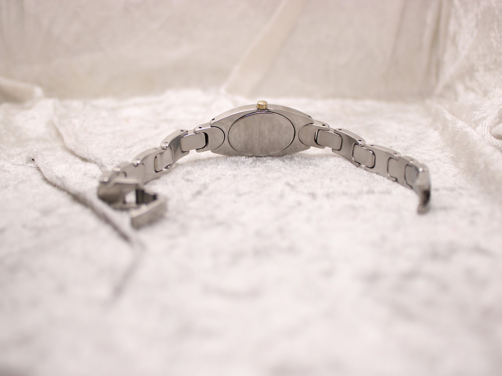 Rear view of the Tissot G350 watch, showing the case back and the full length of the two-tone bracelet.