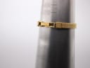 Detail view of the Tissot gold-tone woven bracelet on a wrist sizing cone, indicating a maximum wrist fit of approximately 150mm / 15cm.