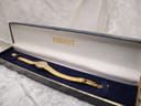 The Tissot ladies' watch with its gold-tone bracelet neatly presented inside its original navy blue Tissot presentation box.