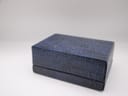 Closed view of the original blue textured Tissot watch presentation box.