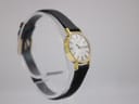 Another angled side view of the Tissot Stylist watch, highlighting the case profile and strap attachment.
