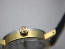 Close-up detail of the gold-plated fluted crown, featuring the embossed Tissot 'T' logo.