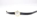 Overhead view of the Tissot Stylist watch with the black leather strap laid flat, showcasing the dial and full length.