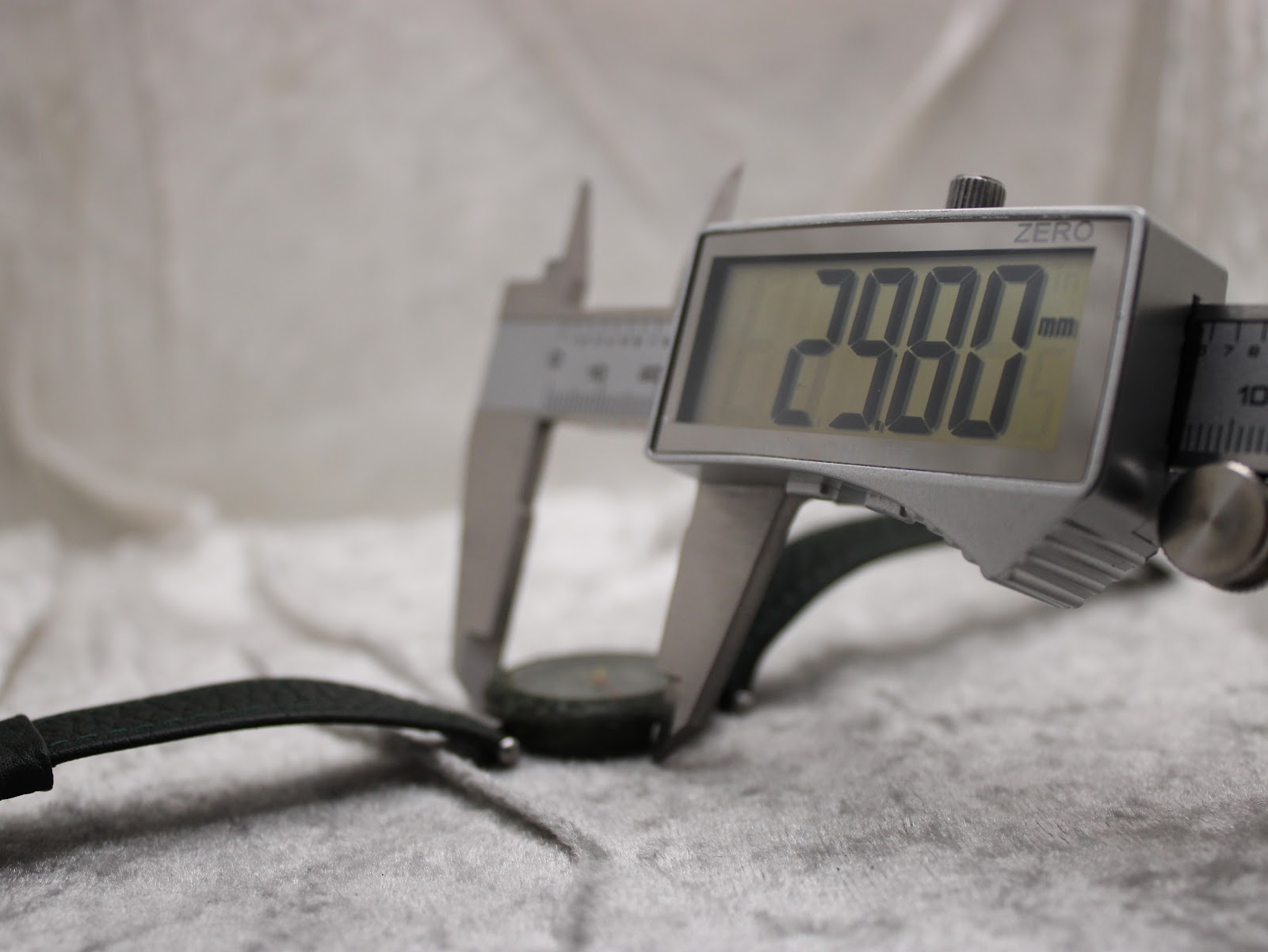 Digital caliper measuring the Tissot RockWatch case diameter, displaying 29.80 mm.