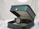Tissot RockWatch displayed inside a dark green presentation box with a gold emblem.