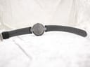 Full back view of the Tissot RockWatch and its green leather strap, showing the underside of the strap.