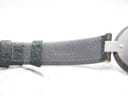 Close-up of the underside of the green leather strap, showing text 'SSG'.