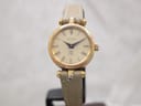 Front view of the Gucci 2000L vintage ladies' watch with a gold-plated case and cream Roman numeral dial, on a stand.