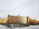 Close-up of the watch case back, showing 'GUCCI' logo, '1500L', and serial number '0250756'.