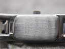 Close-up of the case back engraving, showing "GUCCI timepieces", "3900L", "SWISS MADE", "STAINLESS STEEL", "WATER RESISTANT 3 ATM".