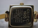 Close-up of the polished stainless steel case back of the Gucci 1900L, displaying model number, 'Swiss Made', 'Sapphire Crystal', 'Water Resistant 3 ATM', and serial number.