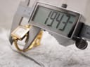 Digital caliper measuring the case width of the Gucci 1900L, showing a precise measurement of 19.43mm.