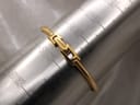 Close-up of the gold-plated bangle clasp of the Gucci 1900L watch on a sizing mandrel, indicating a wrist size of approximately 170mm or 17cm.