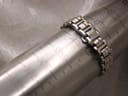 The Gucci 9040L watch bracelet wrapped around a wrist sizing gauge, clearly indicating a 150mm circumference.