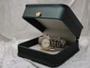 The Gucci 9040L watch displayed inside a dark green presentation box with a gold crown emblem on the lid.