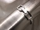 Gucci bangle bracelet on a wrist sizing gauge, showing a fit of approximately 150mm.