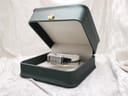 Gucci 1500L watch displayed in an open green watch box with a gold crown emblem.