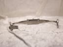 Close-up of the signed Gucci clasp on the bangle bracelet, with the watch body slightly out of focus in the background.
