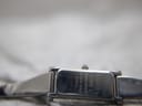 Close-up of the case back of the Gucci 1500L, engraved with "GUCCI 1500 L SWISS MADE STAINLESS STEEL 0949396".